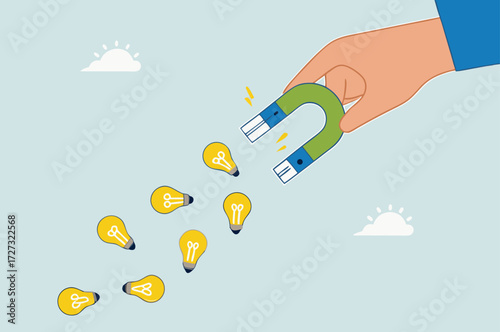 businessman with magnet to magnetize light bulb ideas.