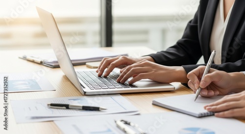 Business Teamwork with Laptop and Documents in Office