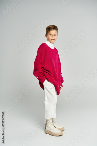 Wallpaper Mural Stylish preteen boy showcases trendy winter fashion in a studio setting Torontodigital.ca