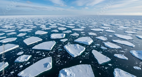 Aerial Arctic View of Jagged Ice Floes Floating on Deep Blue, Frozen Waters