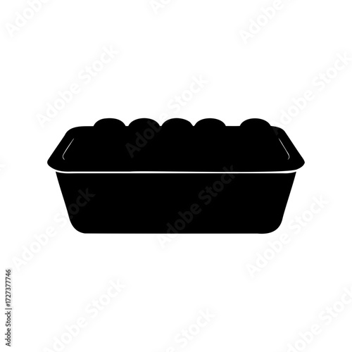A black silhouette of a loaf of bread in a baking pan