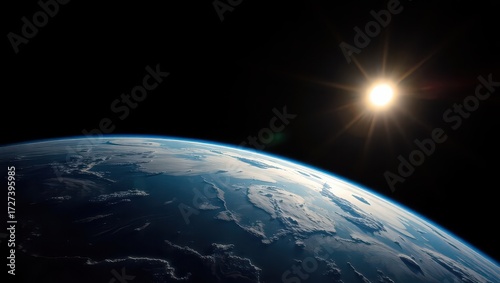 Earth from space with the sun shining brightly in the background