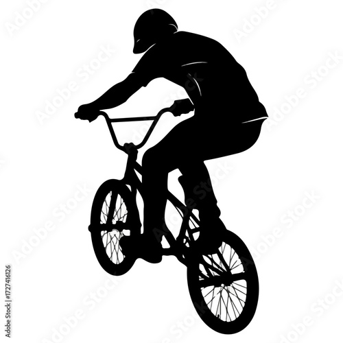 BMX rider in action performing a trick silhouette.