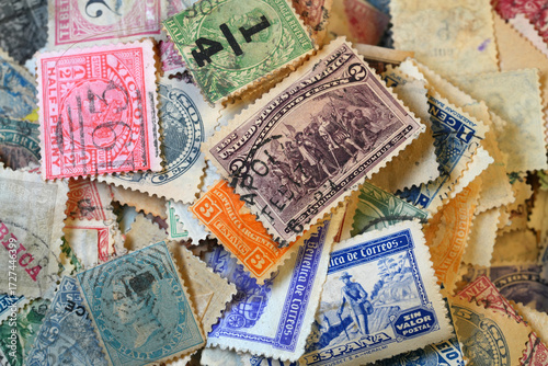 A vibrant, intricate collection of vintage postage stamps from various countries, showcasing historical designs and postal markings.