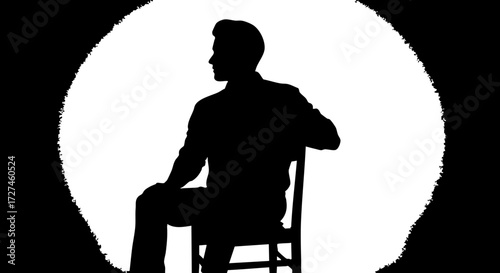 Fotografía Confident man seated in spotlight silhouette, exuding power and thoughtful contemplation for professional presentations and modern concepts