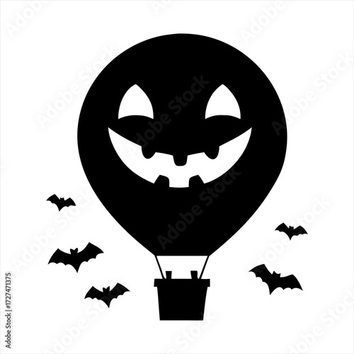 Halloween hot air balloon with a jack o lantern face and flying bats