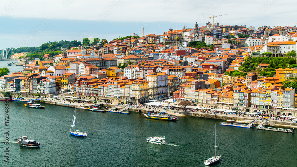 Fototapeta premium Porto, Portugal - July 10 2025: The picturesque landscape of river shore of Douro River in Portugal