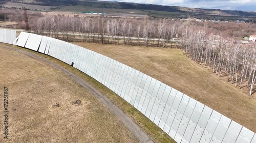 Karachay Cherkessia, Russia - September 12, 2024: A close up aerial view of the sheer, massive reflector panels that form the circular wall of the RATAN 600 radio telescope, contrasting with the nearb