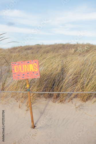 Dunes sign on the beach, Costa De Caparica, Portugal