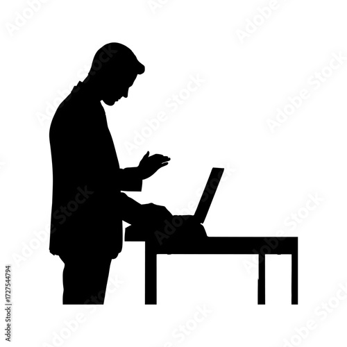 Silhouette of a businessman in a suit working diligently on a laptop at a desk vector