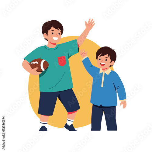 Two young brothers giving a high five while holding a football.