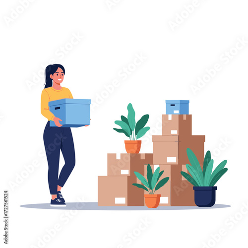 Woman carrying a box to move into a new home.