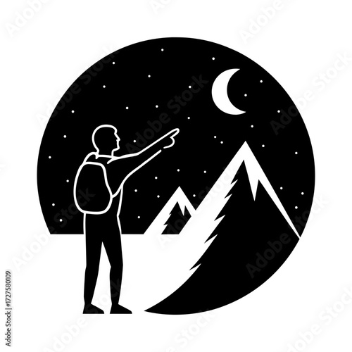 Silhouette of a hiker pointing at the moon over mountains at nighttime