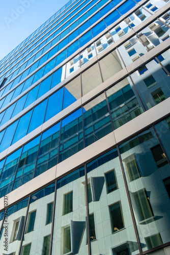 Wallpaper Mural Vertical alignment of glass façades reflecting modern architecture, corporate office design showing clarity, geometry, progress and copy space background for branding, posters and layouts Torontodigital.ca