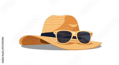 A straw hat with sunglasses on top for summer holidays.