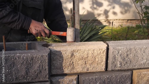 Laying a fence from a decorative block with a seam.