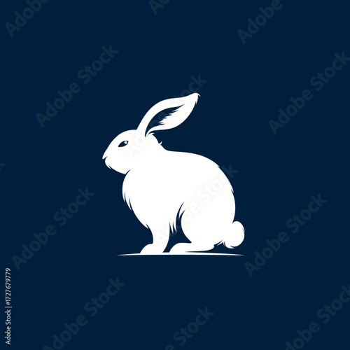 White silhouette of a rabbit sitting sideways on a dark blue background
