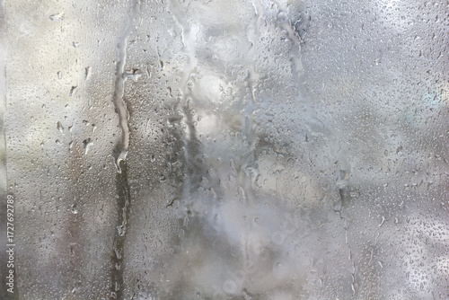 Frozen Drops on Frosted Glass. Winter Textured Background.