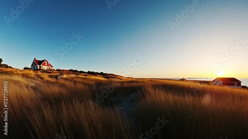 Scenic Coastal View with Red Roofed Houses at Sunset over the Horizon