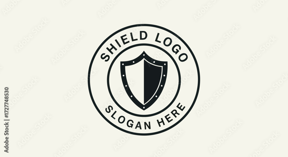 Fototapeta premium A circular emblem featuring a stylized shield divided into black and white halves, enclosed by text indicating 