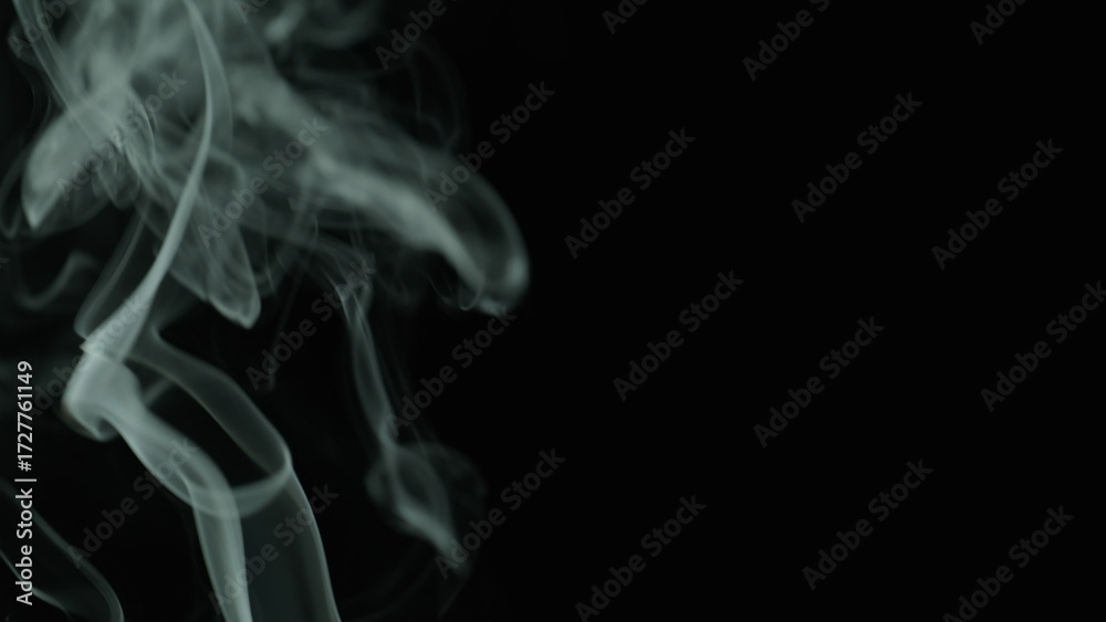 Fototapeta premium Closeup thin stream smoke from extinguished candle after meditation in studio