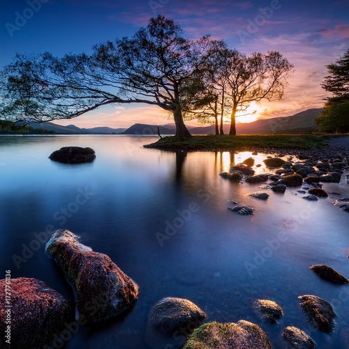 At dusk amidst the scenery and trees Romantic evening in lake district with beautiful sky; 
