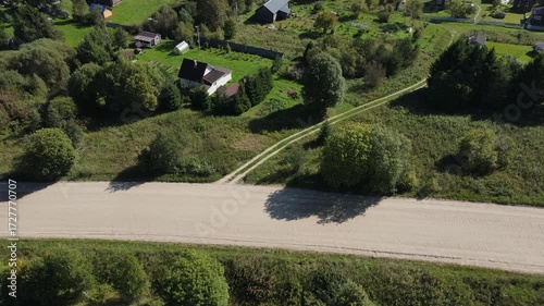 poor country houses, villas, cottages and mansions outside the city among the greenery in the forest filmed from the height of a drone