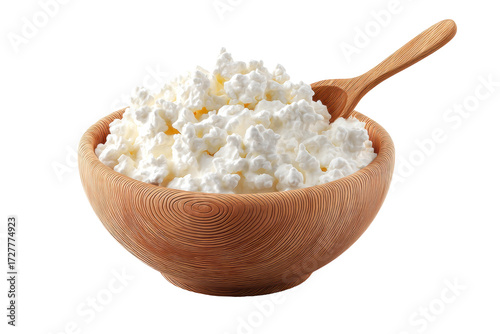 Wooden bowl of cottage cheese with wooden spoon on black background, cut out