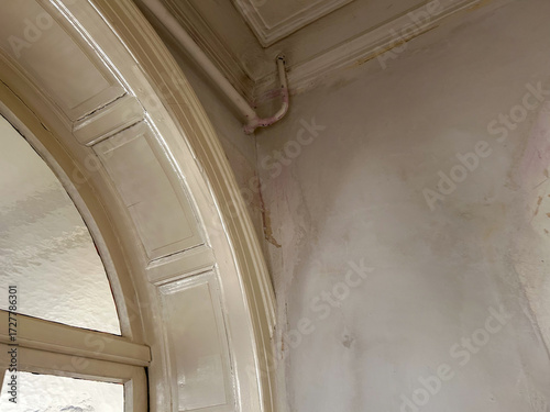 Wallpaper Mural old welded open water pipe in a villa with damaged walls, Torontodigital.ca