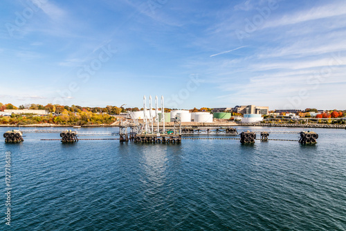 Wallpaper Mural view to skyline of Groton from the seaside with view to industrial area with tank farm Torontodigital.ca