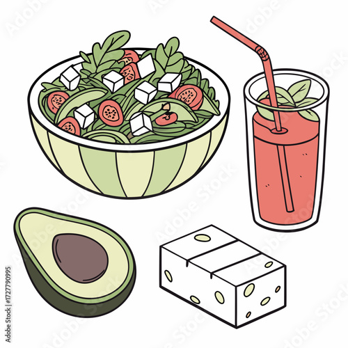 Healthy salad with avocado and feta cheese served with a refreshing drink