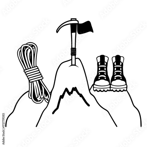 Mountain climbing gear including ice axe rope and boots on a peak