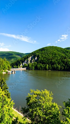 Scenic lake surrounded by lush hills