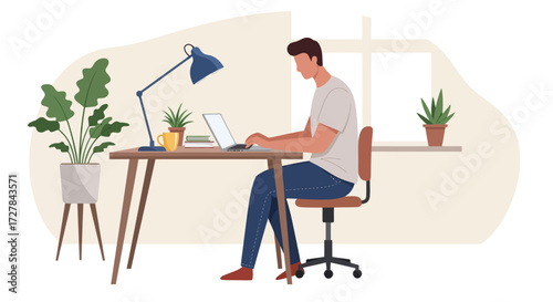 A person working from home on a laptop at a desk with plants and a lamp