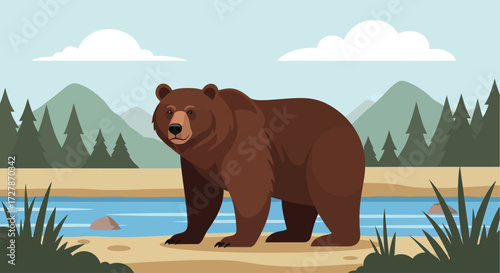 A brown bear stands calmly near a river in a natural landscape, under a blue sky.
