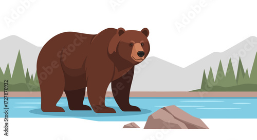 A majestic brown bear stands by a calm blue river with distant mountains and green trees in a natural landscape.