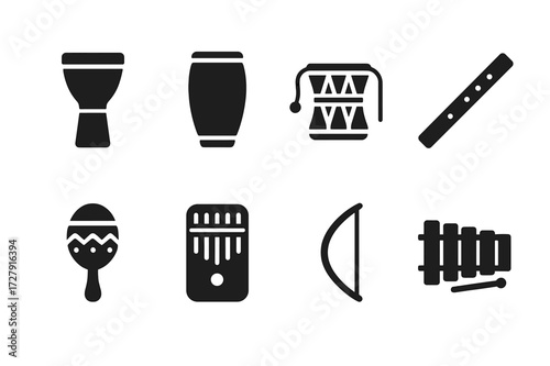 Tribal Instruments Icons. Solid, filled icon set of tribal instruments: djembe, conga, talking drum, flute, rattle, kalimba, bow, xylophone. Solid, filled