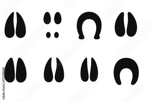Herbivore Tracks Icons. Solid, filled icon set of herbivore tracks: deer hoof print, rabbit footprints, horse hoof print, cow hoof print, moose tracks, elk