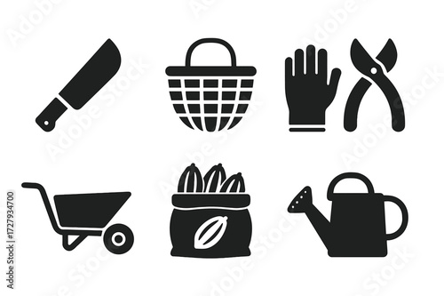 Cocoa Harvest Icons. Solid, filled icon set of cocoa harvesting tools: machete, harvesting basket, gloves, pruning shears, wheelbarrow, sack of pods, drying