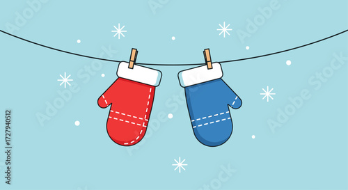 Red and Blue Mittens Hanging on a Clothesline in Snow
