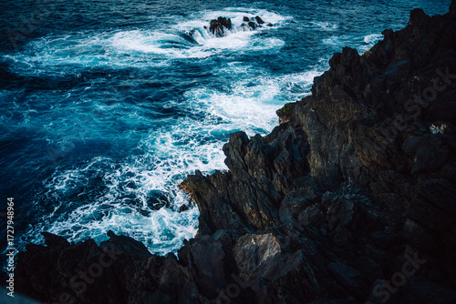blue water waves crashing on rocks