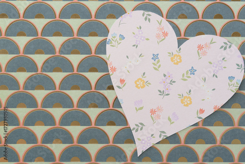 decorative pink paper heart with florals on scrapbooking paper with semi-circle pattern