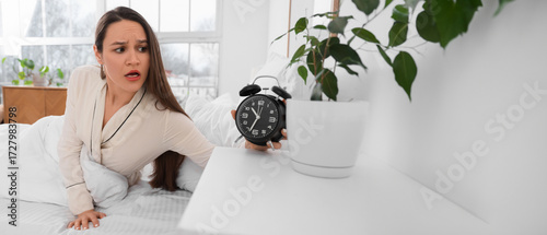 Overslept young woman with ...