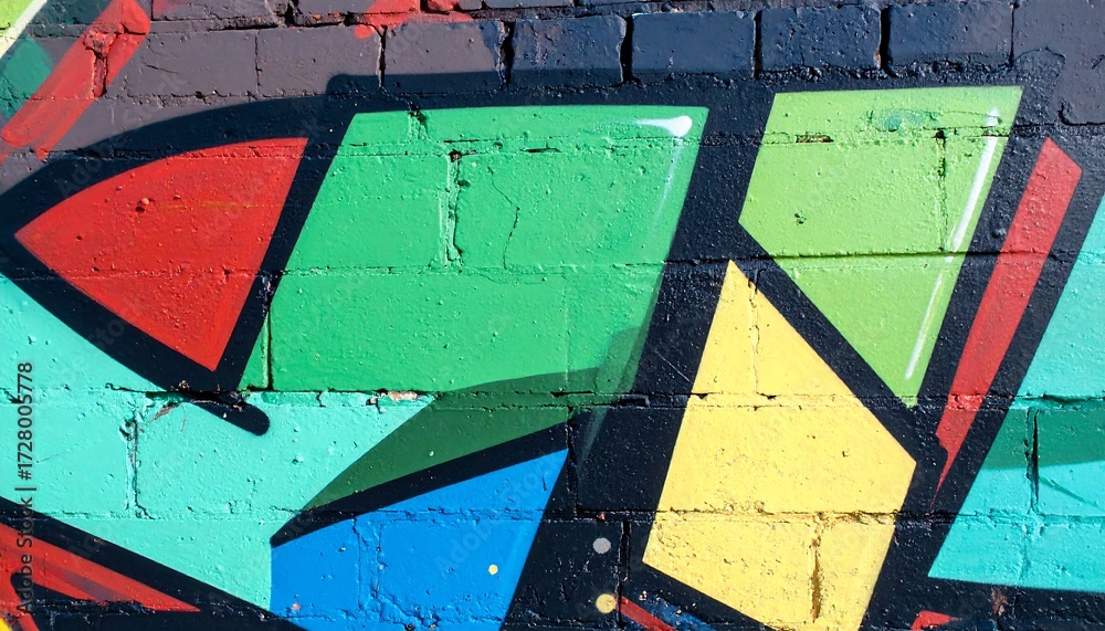 Fototapeta premium Colorful graffiti on a brick wall