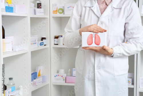 Female pharmacist with medi...