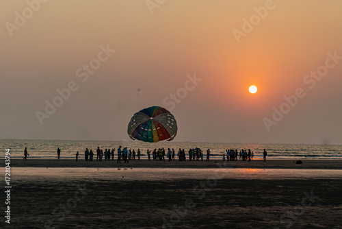 Colorful Paragliding Adventure Over the Sunset at Cox's Bazar Beach, Bangladesh.