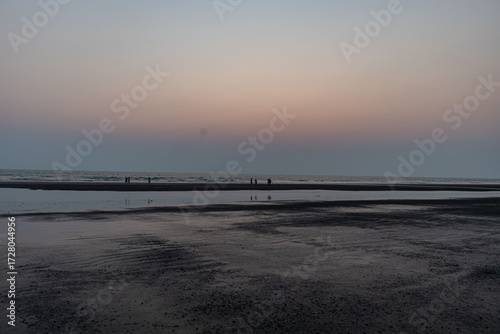 Perfect Sunset Stroll Along the Calm Cox’s Bazar Beach, Bangladesh.