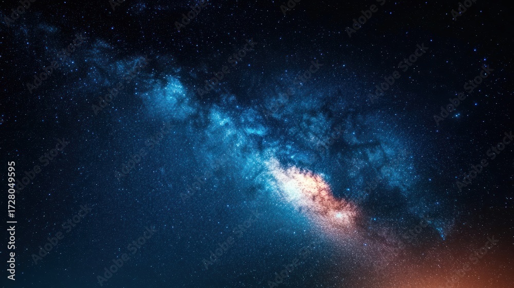 Obraz premium Vivid night sky filled with countless stars and a bright, colorful Milky Way galaxy stretching across the darkness, evoking awe and wonder at the vast universe