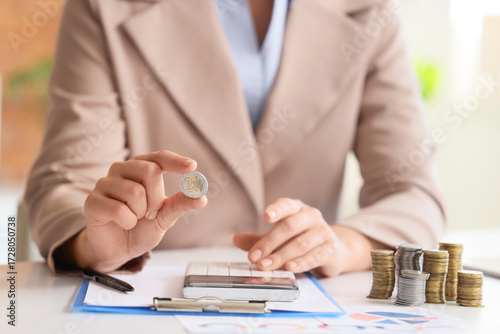 Businesswoman with coin and...