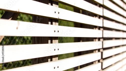 White Wooden Fence with Green Background, Detailed Close-Up View